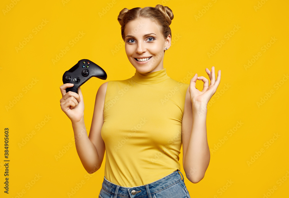 Gorgeous happy blonde gamer girl playing video games using joystick Gorgeous happy blonde gamer girl playing video games using joystick