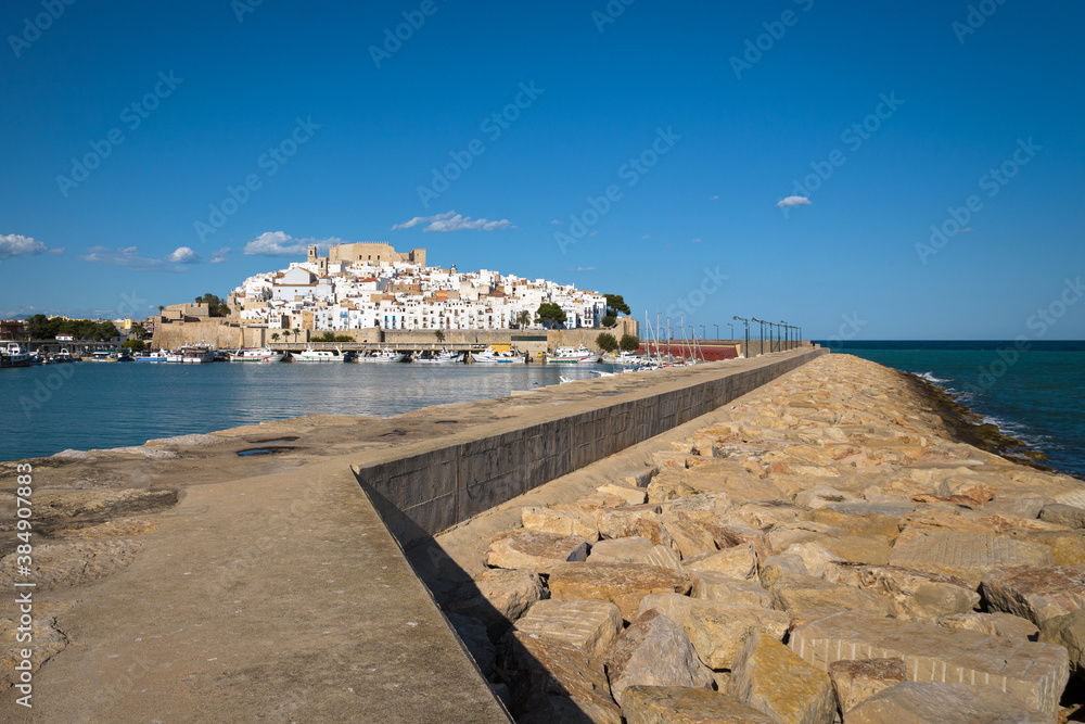 Peniscola harbor from the breakwater with the castle and the walled precinct in the background, Castellon, Spain