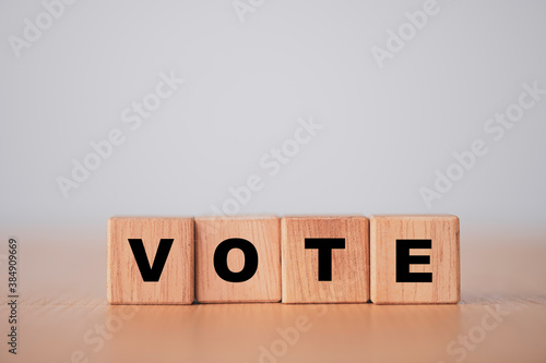 Fototapeta Naklejka Na Ścianę i Meble -  Vote and election concept, Vote wording print screen on wooden cubes block.