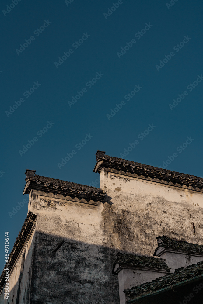 Sunrise view of the architectures in Xidi village, an ancient Chinese village in Anhui Province, China, a UNESCO world cultural heritage site. Sunrise view of the architectures in Xidi village, an ancient Chinese village in Anhui Province, China, a UNESCO world cultural heritage site.