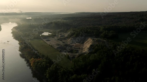 Saint-Francois River And Lush Forest On A Foggy Morning In Windsor, Quebec, Canada. - aerial drone shot photo