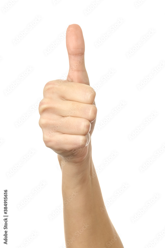 Thumb up. Woman hand gesturing isolated on white Thumb up. Woman hand gesturing isolated on white