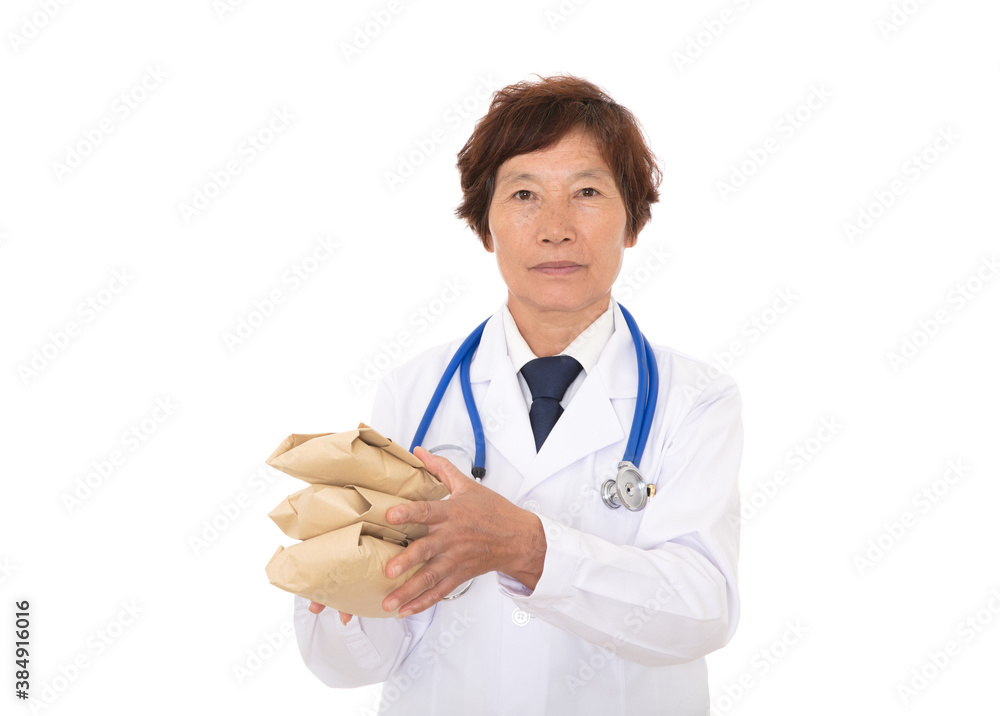 Doctor in white coat holding Chinese medicine in hand on white background Doctor in white coat holding Chinese medicine in hand on white background