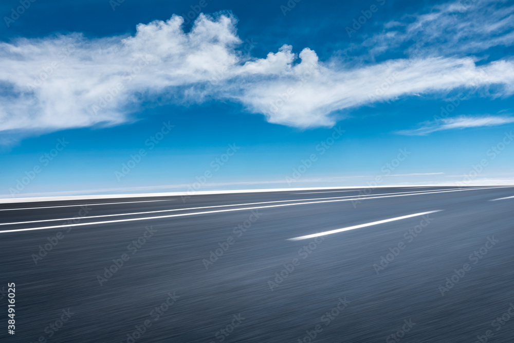 Motion blurred asphalt road and cloud scenery. Motion blurred asphalt road and cloud scenery.