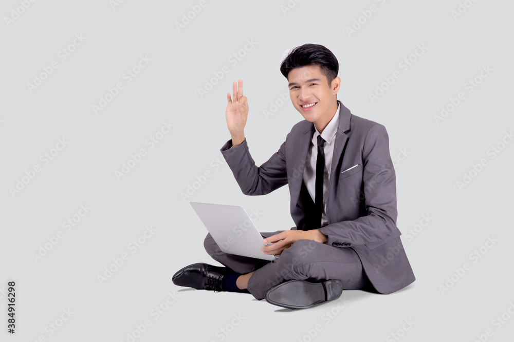 Young asian business man sitting work on laptop computer to internet online isolated on white background, businessman confident and notebook, freelance with success, marketing and communication. Young asian business man sitting work on laptop computer to internet online isolated on white background, businessman confident and notebook, freelance with success, marketing and communication.