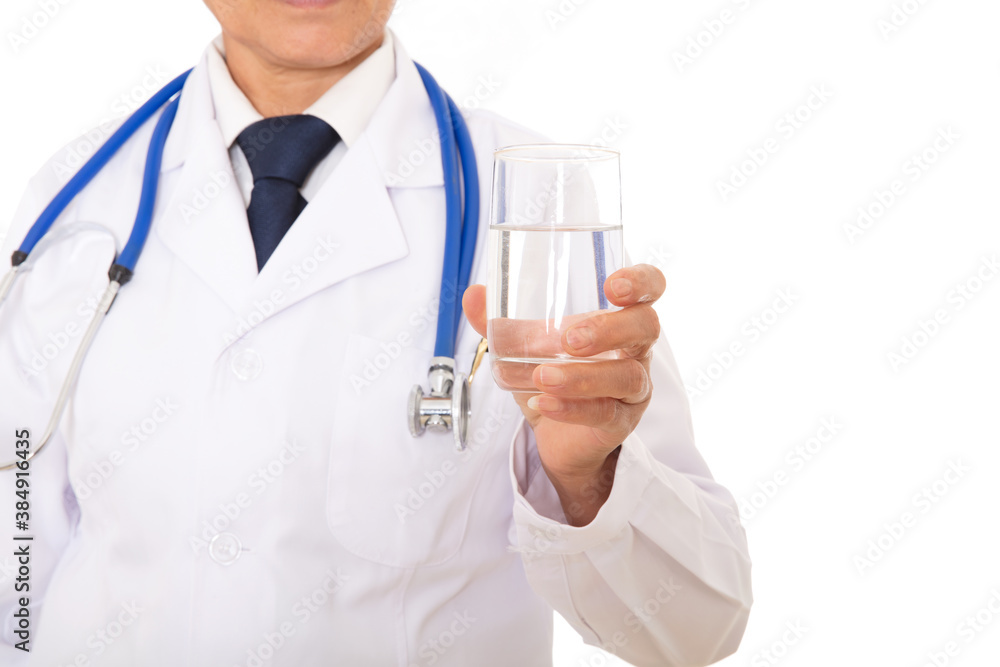 A doctor in a white coat is holding a glass of white water A doctor in a white coat is holding a glass of white water
