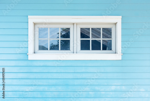 Window on wooden wall. Building abstract background