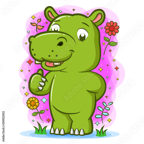 Hippopotamus playing in the garden around the beautiful flowers