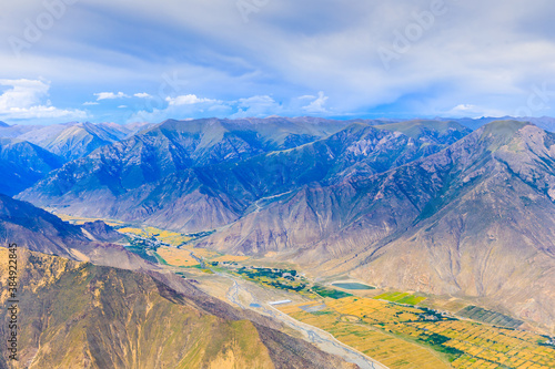 Aerial view of mountain and clouds scenery in Tibet,China. © ABCDstock