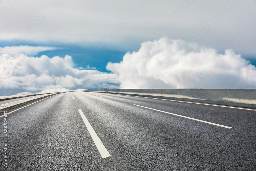 Fototapeta premium Asphalt road and mountain with sky clouds landscape.