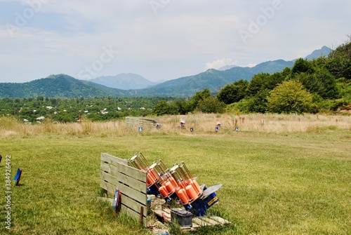 Outdoor skeet shooting club with machine for launching clay pigeon for shooting 