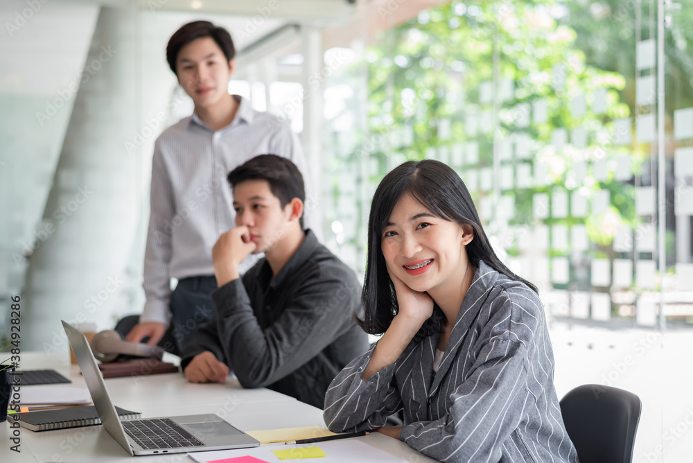 Young asian people office workers meeting and planning work together at their desk. Young asian people office workers meeting and planning work together at their desk.