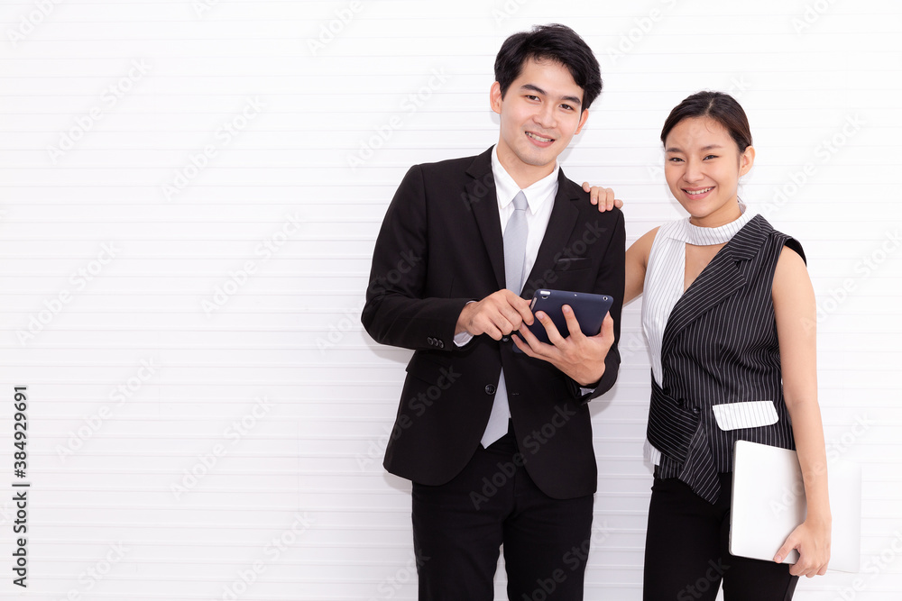 Young couple business man and woman standing with crossed hands against white background. Concept of partnership in business. Young couple business man and woman standing with crossed hands against white background. Concept of partnership in business.