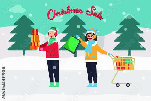Shopping in winter sale vector concept: Two teenagers carrying shopping bag together with words of winter sale © Creativa Images