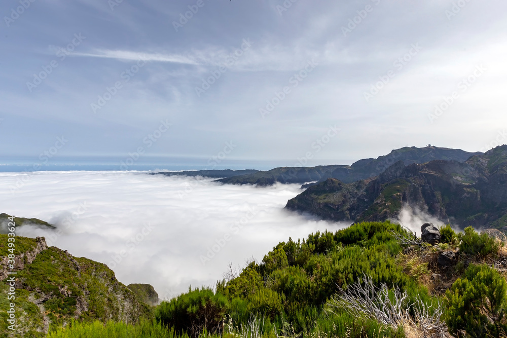 Fototapeta premium Mountains over the clouds on the island of Madeira, Portugal