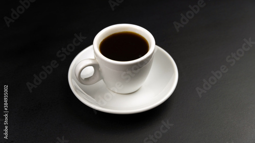 White cup and saucer with coffee