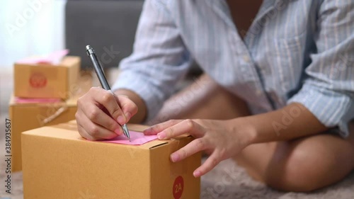 Close up business woman preparing product to send to customer for the online order