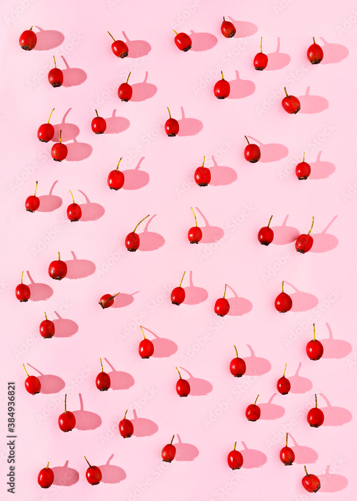 Red berries on pink background Red berries on pink background