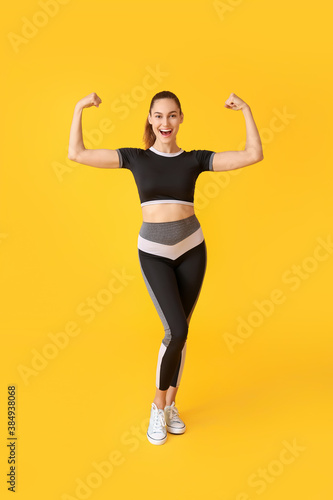Happy sporty young woman on...