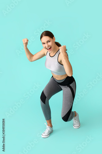 Happy sporty young woman on...