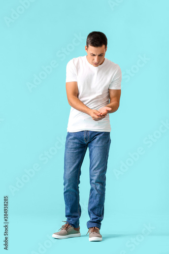 Billede på lærred Man with problem of limbs numbness on color background