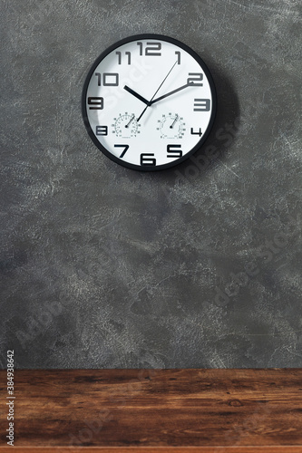 Wallpaper Mural wall clock and table near concrete background Torontodigital.ca