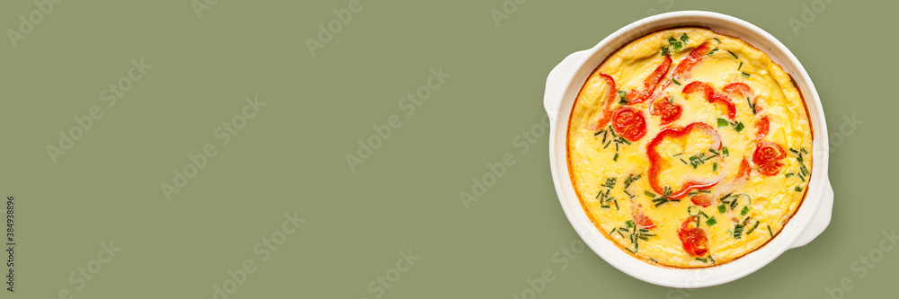 Omelette with vegetables - shakshuka in skillet on a color background. Top view. Banner Omelette with vegetables - shakshuka in skillet on a color background. Top view. Banner