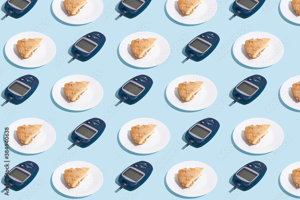 Glucose meter and plate with pie on blue background with shadow, Metabolic syndrome concept Glucose meter and plate with pie on blue background with shadow, Metabolic syndrome concept