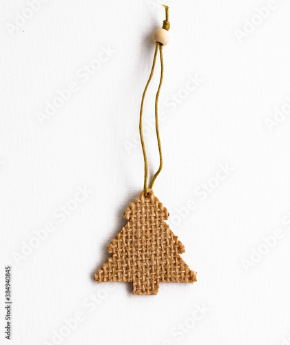 christmas tree shaped wooden element isolated on white background, traditional xmas decoration made of thread or rope