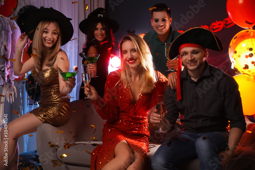 Group of friends having Halloween party at home