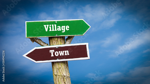 Street Sign to Village versus Town © Thomas Reimer