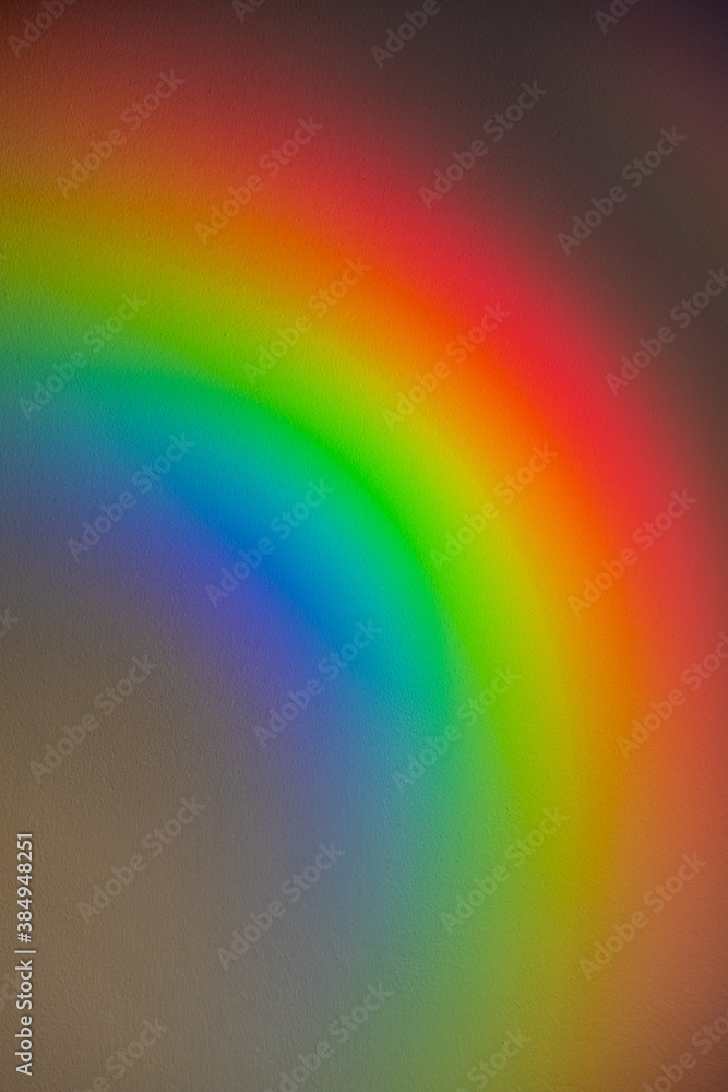 Rainbow abstract background. LGBT pride. Blur vibrant color gradient light. Holographic striped texture. Defocused psychedelic red yellow green blue glow on dark copy space.