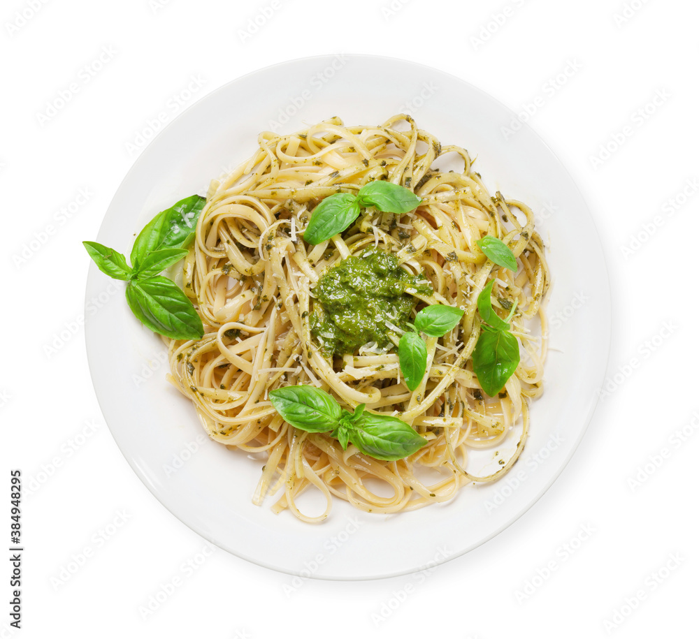 Fettuccine pasta with pesto sauce and basil