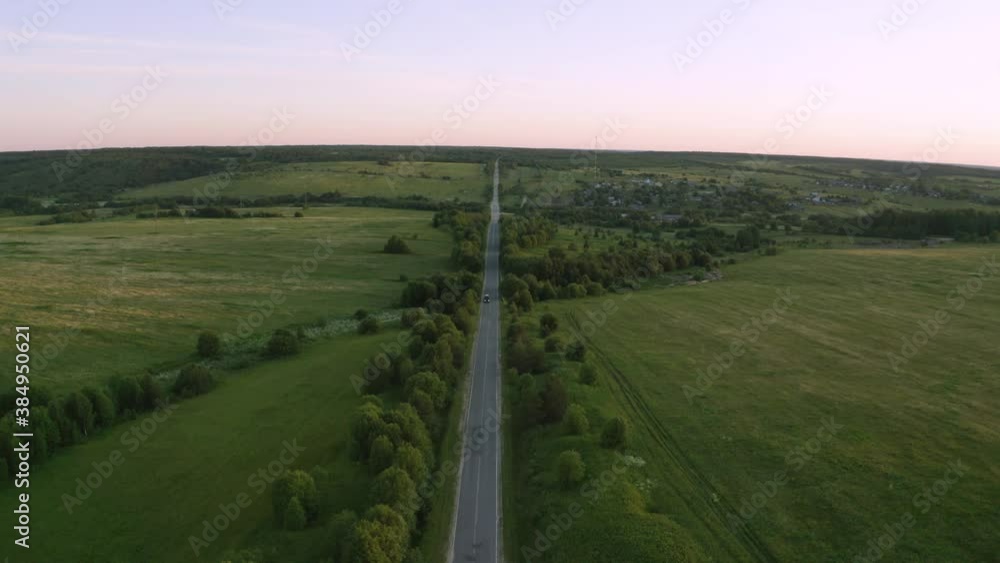 bad asphalt road with large holes top view, federal highway of the Vologda and Kostroma regions in the north of Russia. bad asphalt road with large holes top view, federal highway of the Vologda and Kostroma regions in the north of Russia.