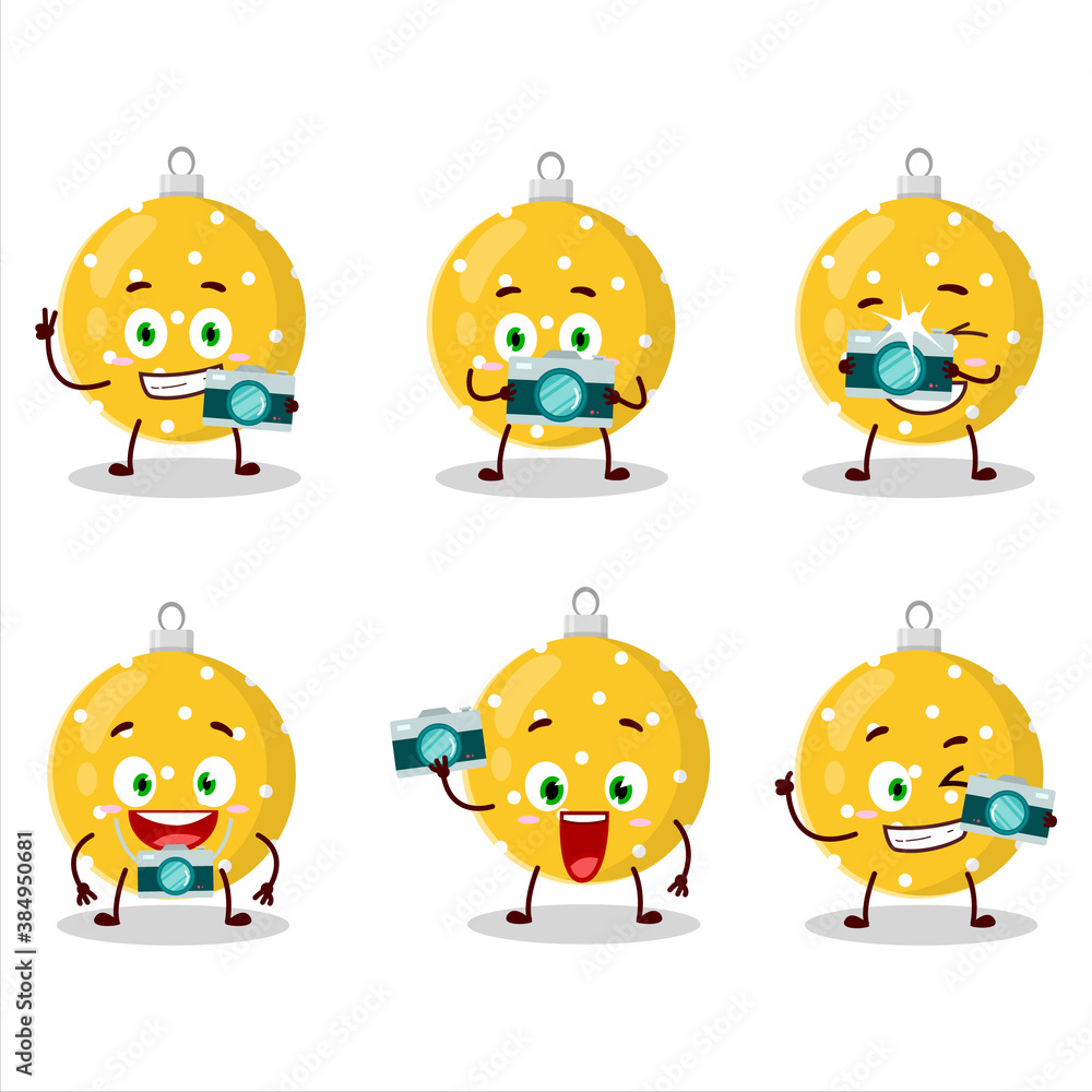 Photographer profession emoticon with christmas ball yellow cartoon character
