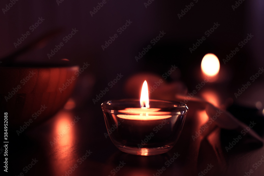 Candle light in Glass cup decoration in spa and christmas night party in Bokeh background. Holiday and Romantic love on valentines day Concept. Candle light in Glass cup decoration in spa and christmas night party in Bokeh background. Holiday and Romantic love on valentines day Concept.