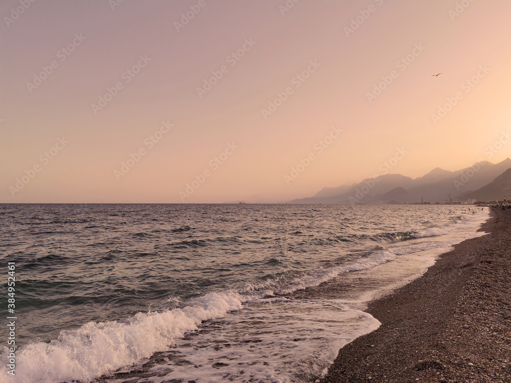 Mediterranean beach. Sunset and sea in Antalyta.