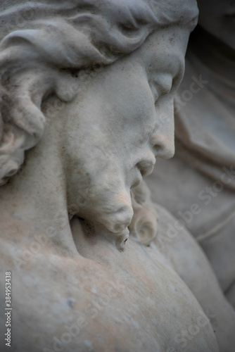 Full frame image of sculpted Jesus face on Victorian cemetery pieta. Selective focus draws the eye toward the facial features. © Mary Salen