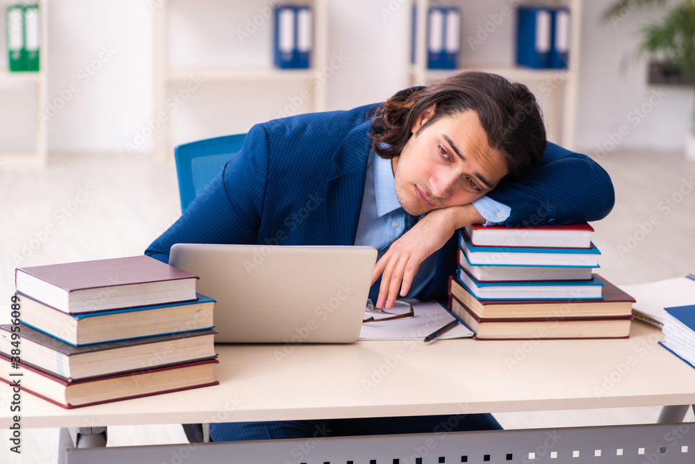 Young businessman student studying at workplace Young businessman student studying at workplace