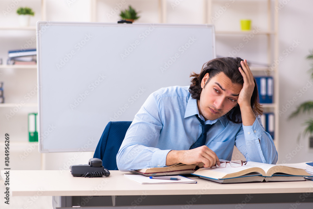 Young businessman student studying at workplace Young businessman student studying at workplace