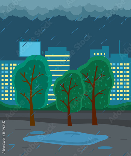 Night autumn city view with strong rain, cold damp weather, raining at evening, scene with trees, buildings with light in windows and puddles on road, gloomy, overcast cloudy scenery, nobody around