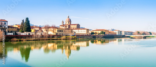 Banks of the Arno in Florence and its reflections in Tuscany, Italy