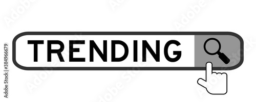 Search banner in word trending with hand over magnifier icon on white background