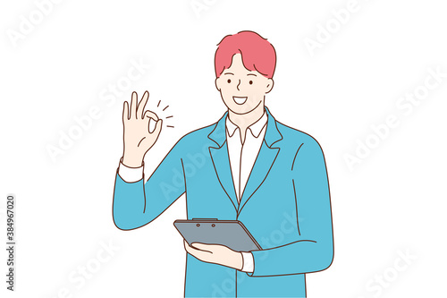 Success, business, approval, work, goal achievement. Young happy positive smiling businessman clerk manager cartoon character standing with tablet and showing ok sign looking at camera illustration.