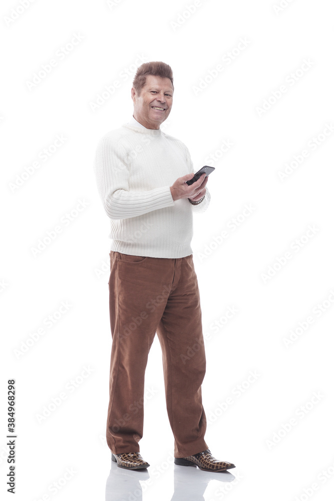 full- length . smiling man reading a message on his smartphone full- length . smiling man reading a message on his smartphone