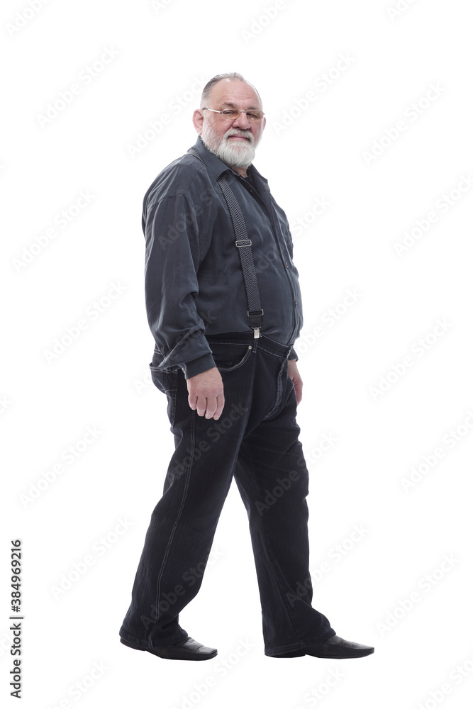 in full growth. happy bearded man striding forward. in full growth. happy bearded man striding forward.