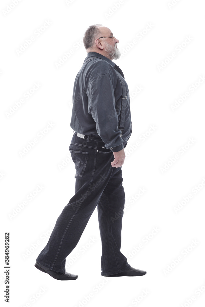 in full growth. happy bearded man striding forward. in full growth. happy bearded man striding forward.