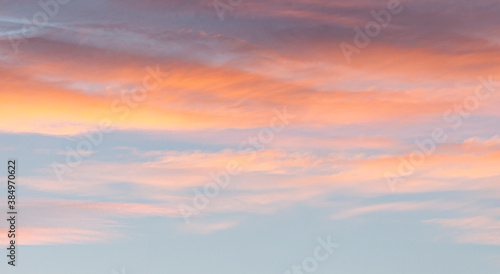 Dramatic colorful sky with afterglow and illuminated clouds