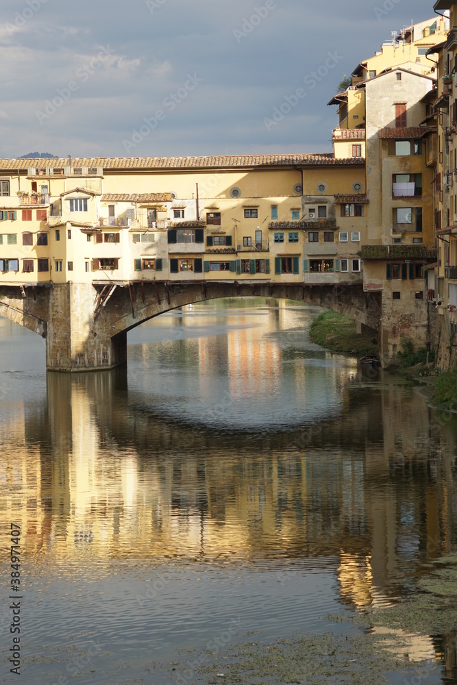 Florence, bridge and houses on Arno River