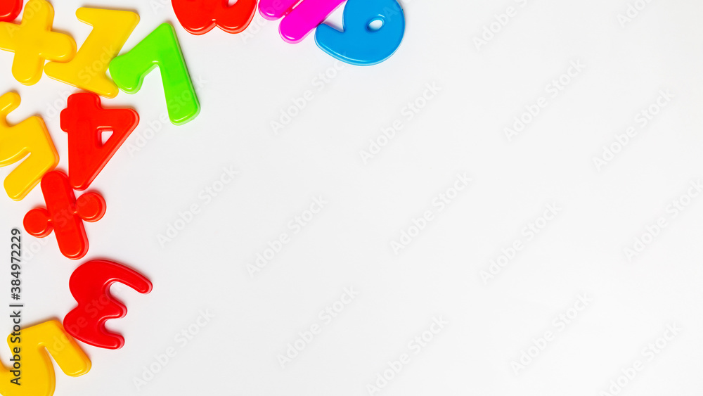 Colorful plastic numberson white background with copy space Colorful plastic numberson white background with copy space